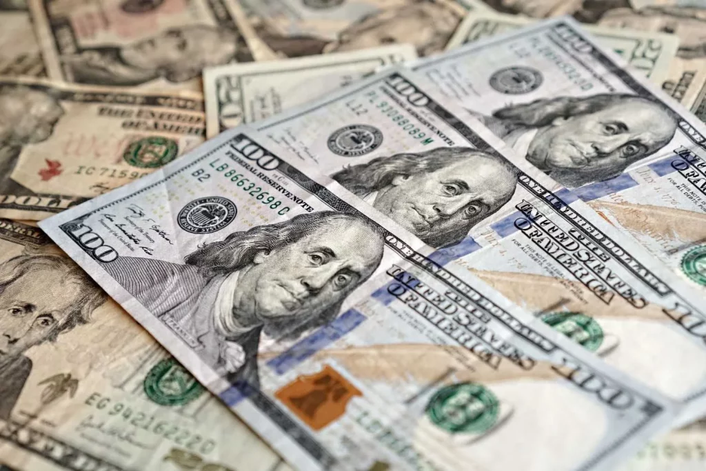 Close-up of various US dollar bills highlighting finance and economy.